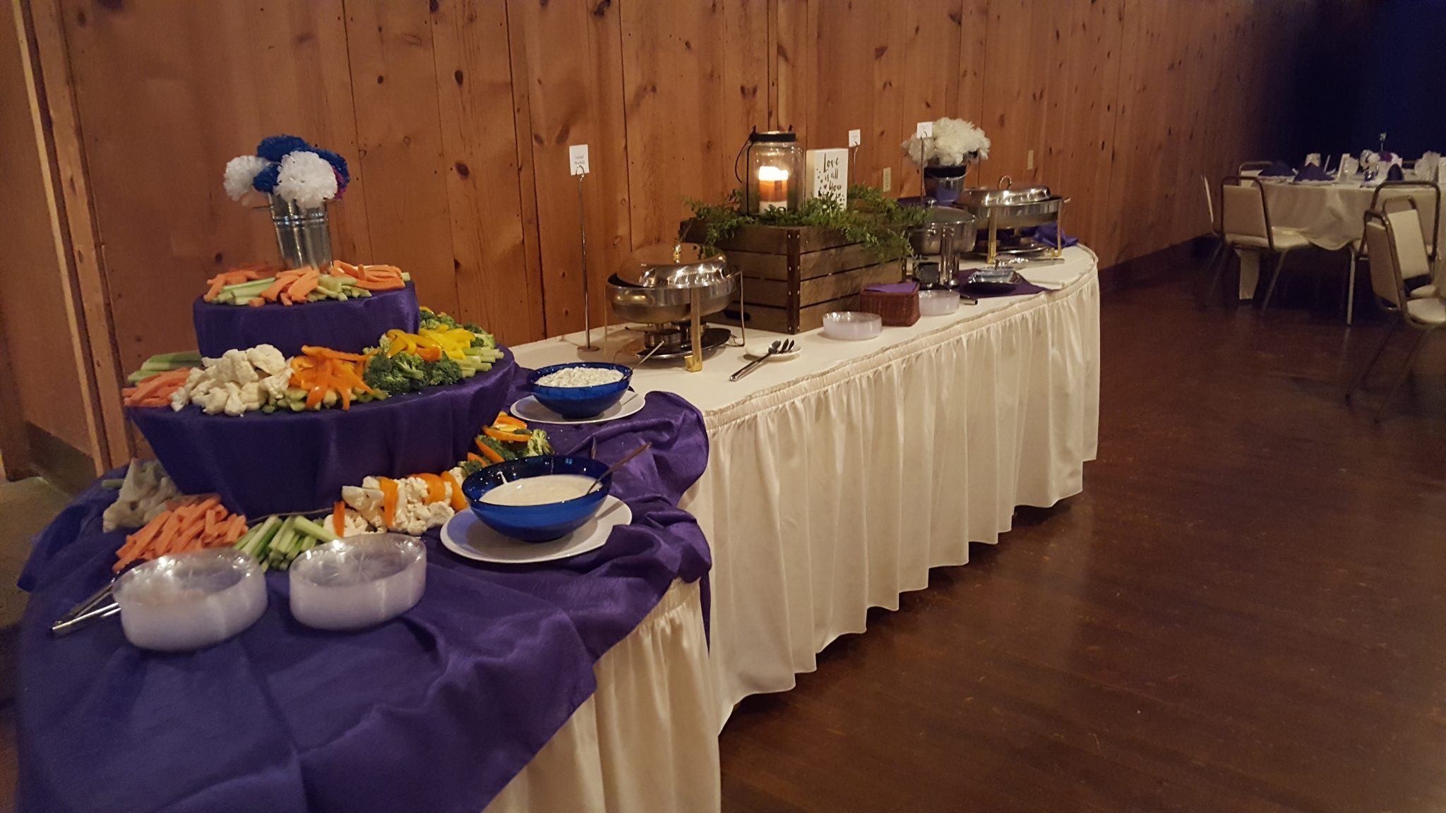A large rectangle table with food containers